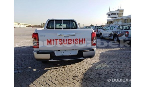 Buy Import Mitsubishi L200 White Car in Import - Dubai in Andijon Buy Import Mitsubishi L200 White Car in Import - Dubai in Andijon