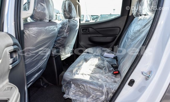 Buy Import Mitsubishi L200 White Car in Import - Dubai in Andijon Buy Import Mitsubishi L200 White Car in Import - Dubai in Andijon