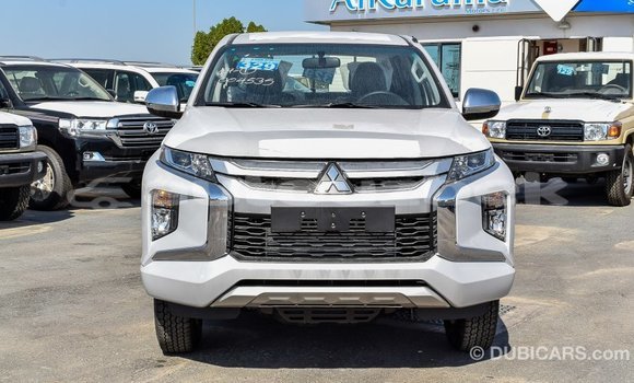 Buy Import Mitsubishi L200 White Car in Import - Dubai in Andijon Buy Import Mitsubishi L200 White Car in Import - Dubai in Andijon