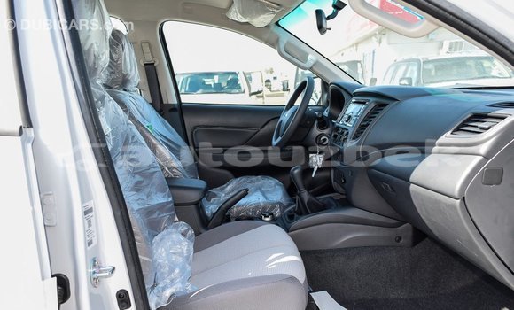 Buy Import Mitsubishi L200 White Car in Import - Dubai in Andijon Buy Import Mitsubishi L200 White Car in Import - Dubai in Andijon