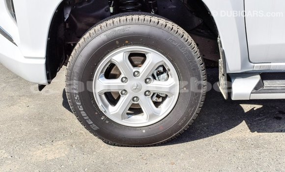 Buy Import Mitsubishi L200 White Car in Import - Dubai in Andijon Buy Import Mitsubishi L200 White Car in Import - Dubai in Andijon