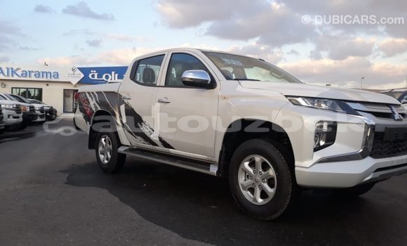 Buy Import Mitsubishi L200 White Car in Import - Dubai in Andijon Buy Import Mitsubishi L200 White Car in Import - Dubai in Andijon