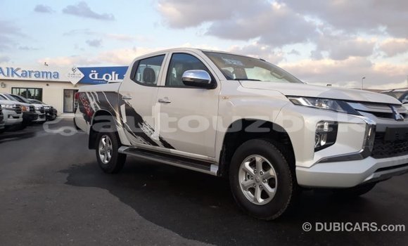 Buy Import Mitsubishi L200 White Car in Import - Dubai in Andijon Buy Import Mitsubishi L200 White Car in Import - Dubai in Andijon