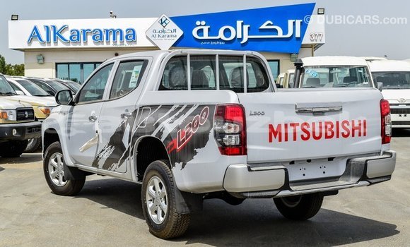 Buy Import Mitsubishi L200 White Car in Import - Dubai in Andijon Buy Import Mitsubishi L200 White Car in Import - Dubai in Andijon