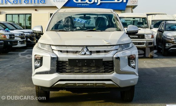 Buy Import Mitsubishi L200 White Car in Import - Dubai in Andijon Buy Import Mitsubishi L200 White Car in Import - Dubai in Andijon