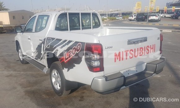Buy Import Mitsubishi L200 White Car in Import - Dubai in Andijon Buy Import Mitsubishi L200 White Car in Import - Dubai in Andijon
